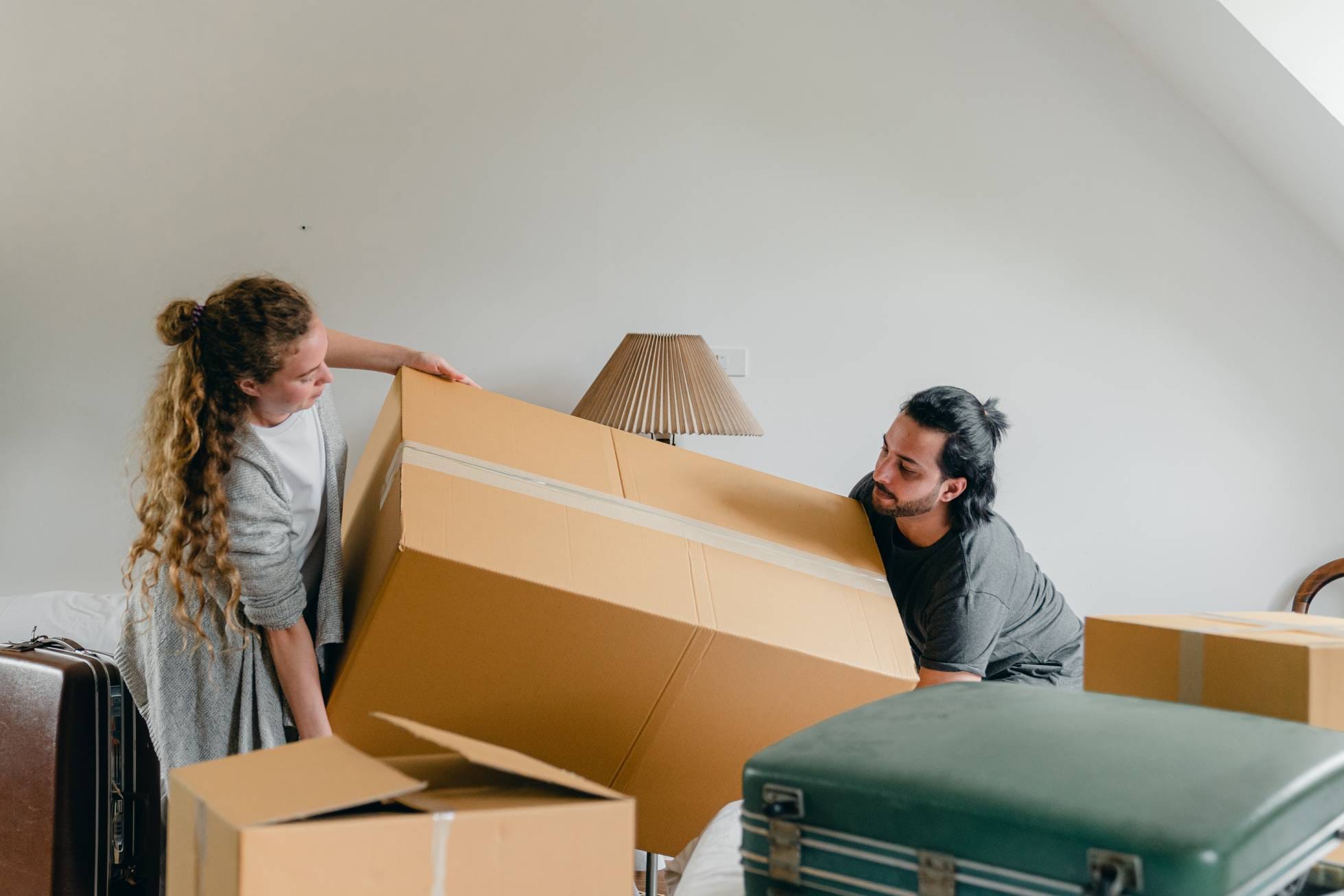 Couple moving boxes